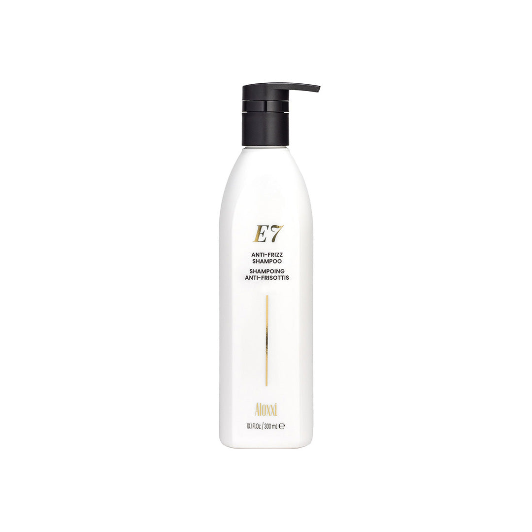 White shampoo bottle with black pump labeled 'E7' on a white background